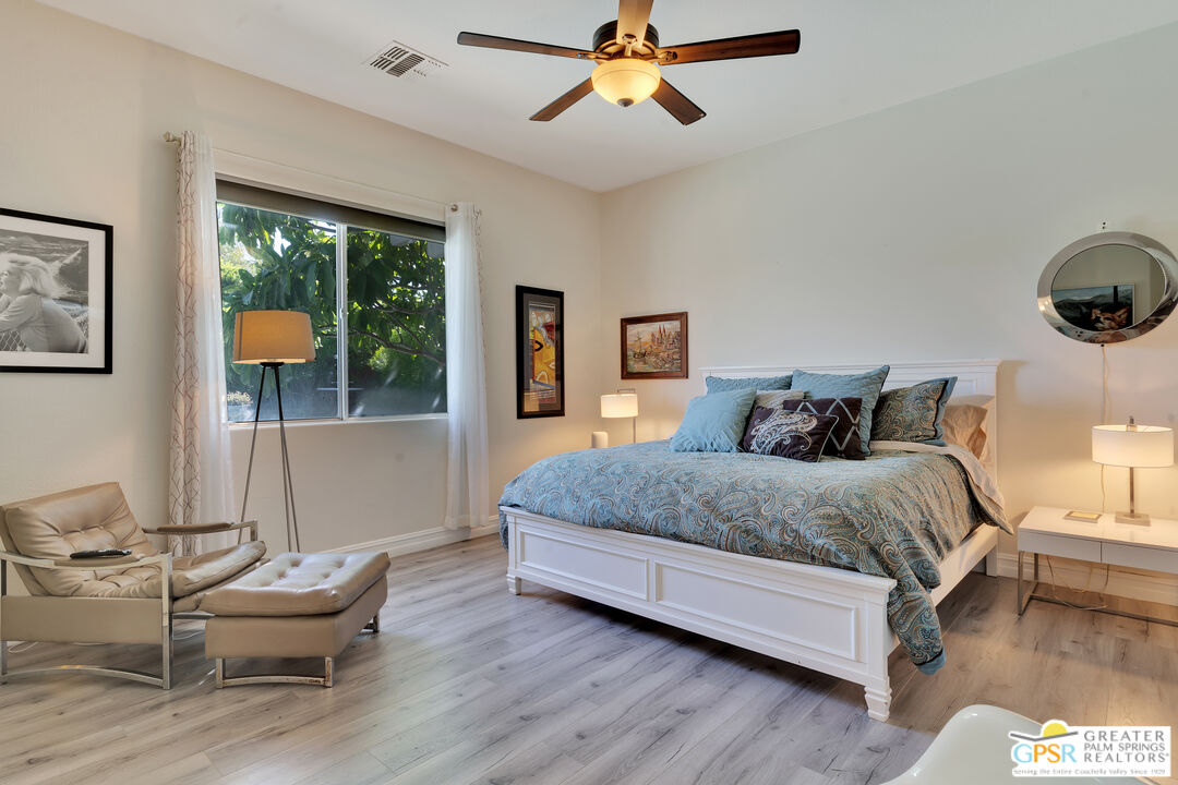 68315 Riviera Road Cathedral City, CA 92234 - Photo 24 of 33 a bedroom with a bed and window