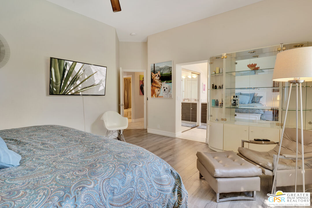 68315 Riviera Road Cathedral City, CA 92234 - Photo 25 of 33 a bedroom with a bed and couch