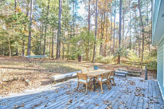 a view of a backyard with sitting area