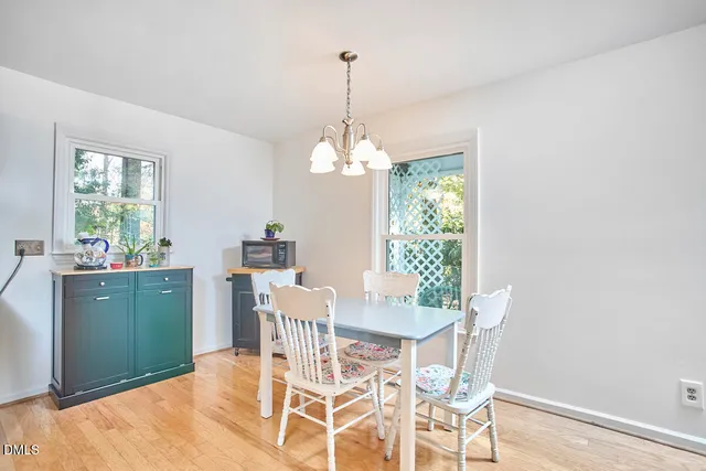 a living room with furniture a rug and a fireplace