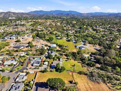 a view of a city with mountains in the background