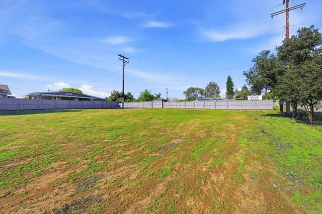 a view of a swimming pool and an outdoor space