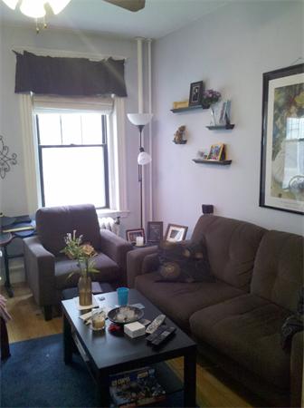 2 Sutherland Road, Unit 22 Boston, MA 02135 - Photo 2 of 4 a living room with furniture and a window