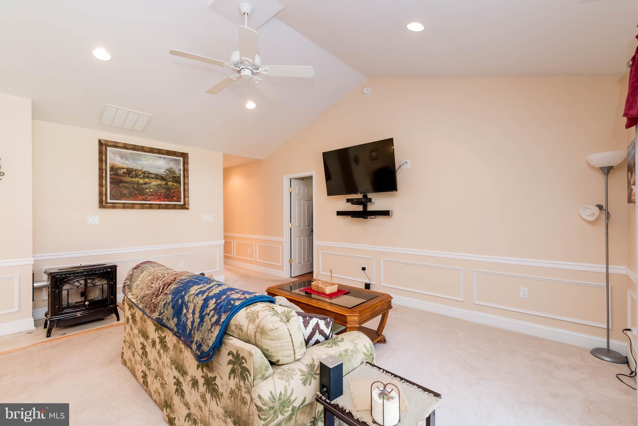 28 Brookfield Road Pasadena, MD 21122 - Photo 11 of 28 Family Room with pellet stove for warmth in winter