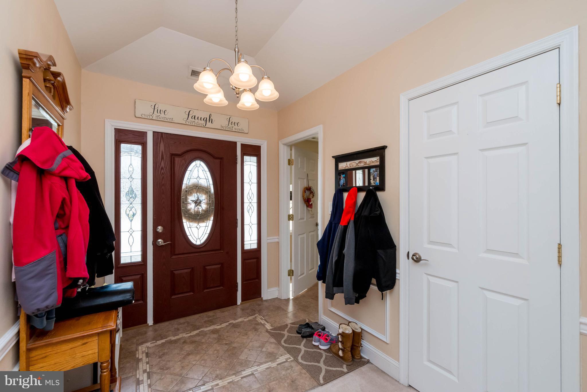 28 Brookfield Road Pasadena, MD 21122 - Photo 10 of 28 Foyer and decorative door with windows for light