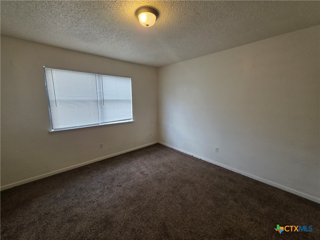 3409 Victoria Circle, Unit 4 Killeen, TX 76543 - Photo 6 of 10 an empty room with a window