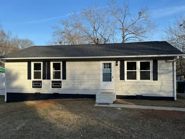 a view of house with yard