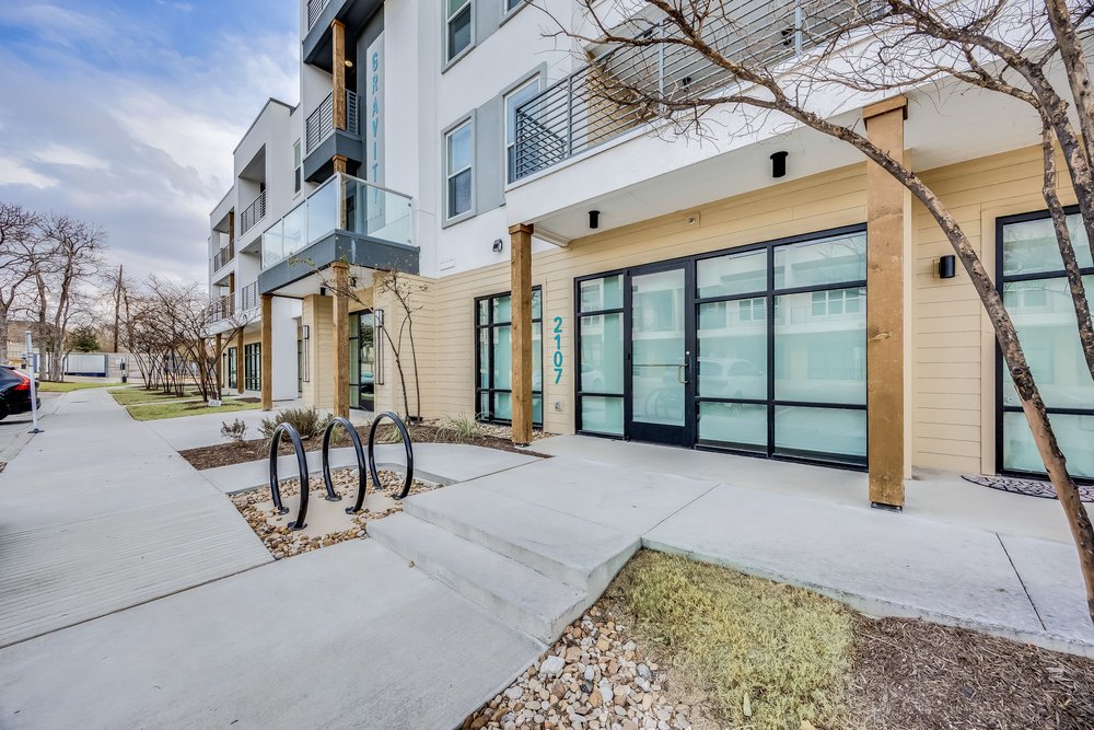 4801 Springdale Road, Unit 2107 Austin, TX 78723 - Photo 1 of 26 a view of a building with a bench
