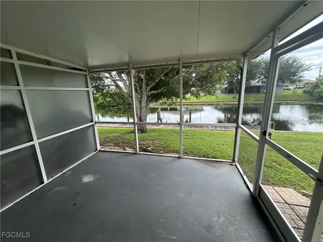 a view of an empty room with sliding glass door