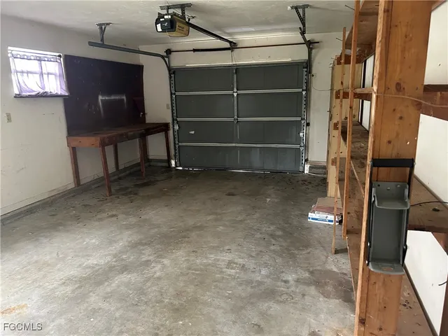 a view of an empty room with a fireplace