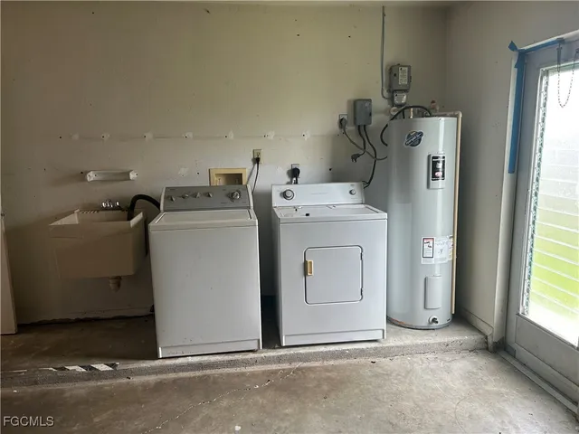 a utility room with dryer and washer