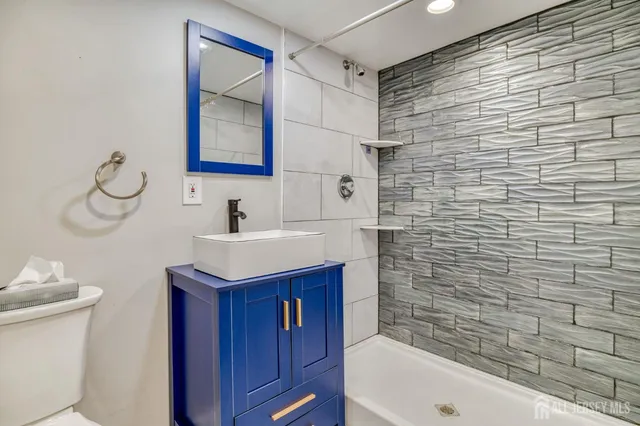 a bathroom with a sink and a bathtub
