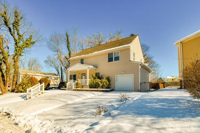 a view of a building with a snow on the road