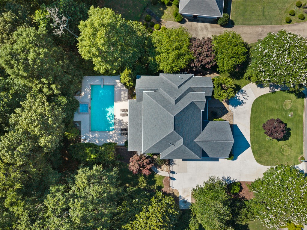 200 Graylyn Drive Anderson, SC 29621 - Photo 46 of 48 An aerial perspective reveals a private oasis, complete with a sparkling pool and spa, nestled amidst verdant landscaping.
