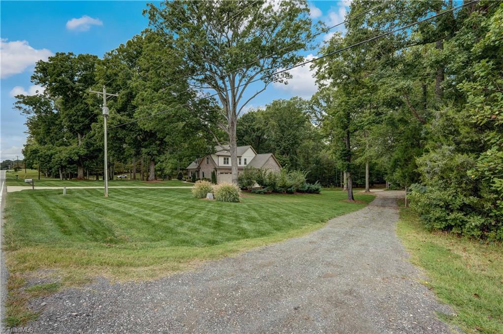 2733 Pleasant Ridge Road Summerfield, NC 27358 - Photo 39 of 41 Separate driveway to detached garage with lots of additional parking space for larger vehicles, boats, trailers etc.