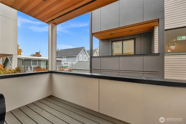a view of a balcony with wooden floor and staircase