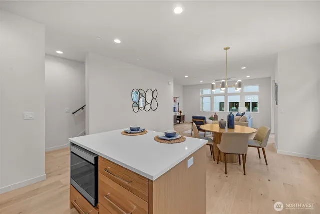 a kitchen with a sink cabinets and window