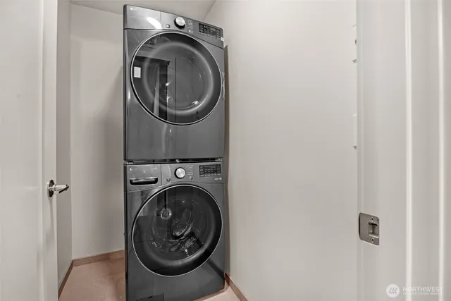 a spacious bedroom with a bed and a lamp