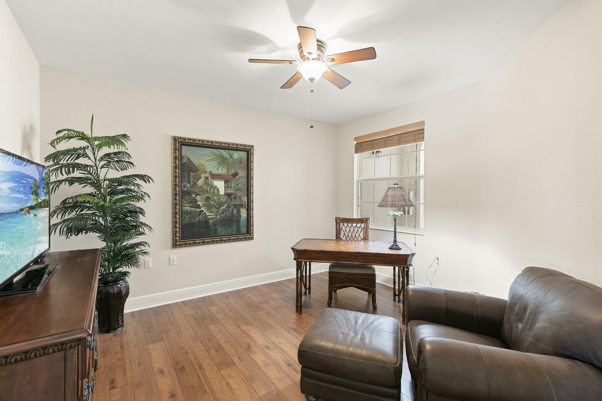 9066 Cascada Way, Unit 101 Naples, FL 34114 - Photo 21 of 51 a living room with furniture and a potted plant