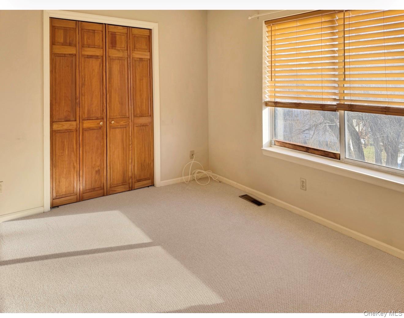 276 Temple Hill Road, Unit 1704 New Windsor, NY 12553 - Photo 14 of 22 a view of an empty room with a window