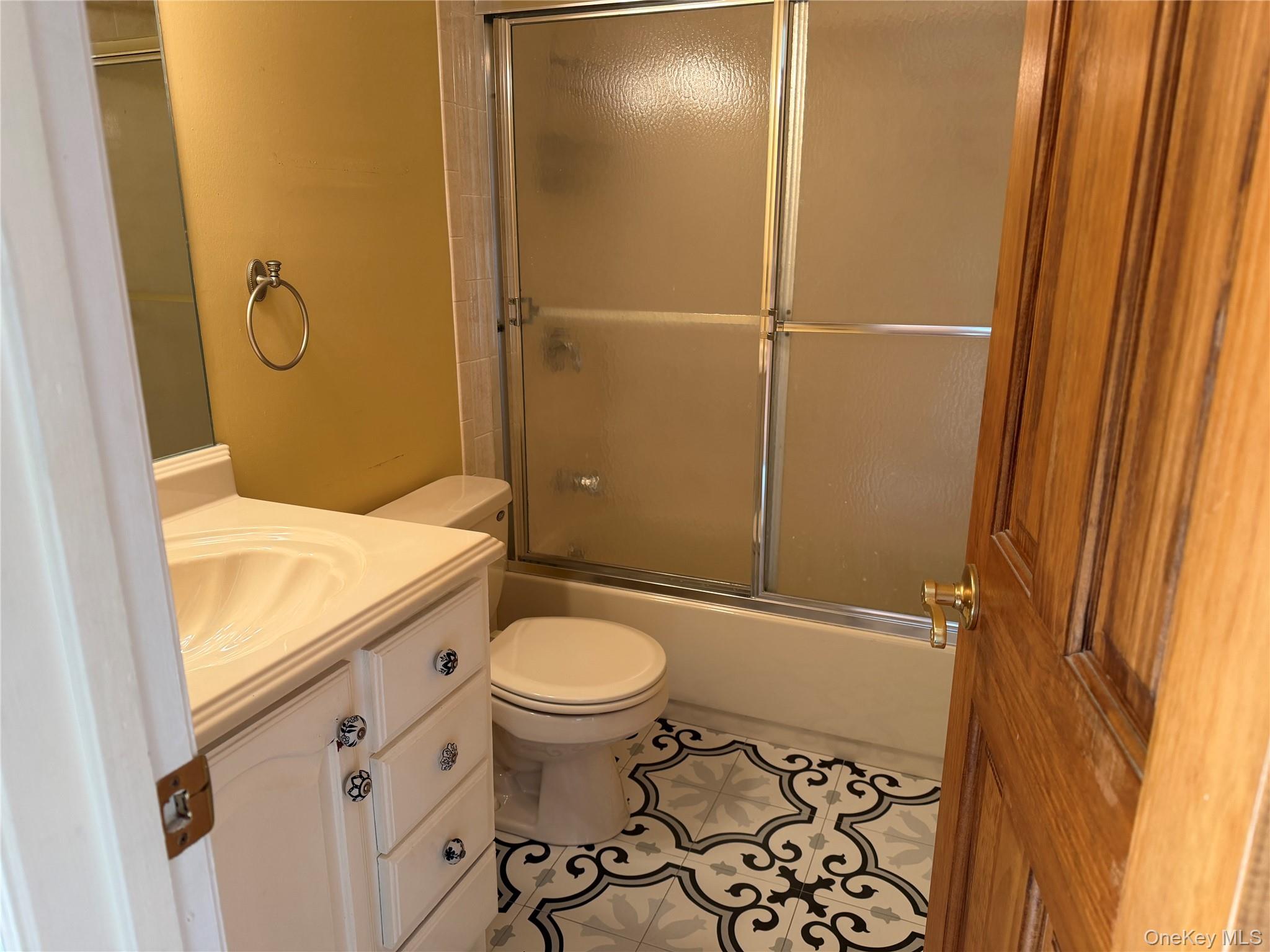 276 Temple Hill Road, Unit 1704 New Windsor, NY 12553 - Photo 15 of 22 a bathroom with a granite countertop sink toilet and shower