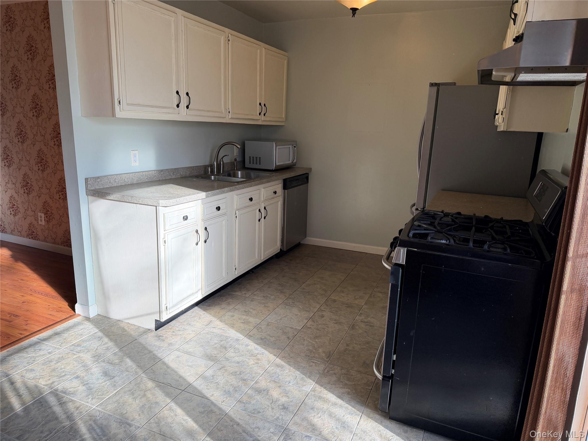 276 Temple Hill Road, Unit 1704 New Windsor, NY 12553 - Photo 5 of 22 a kitchen with sink and cabinets