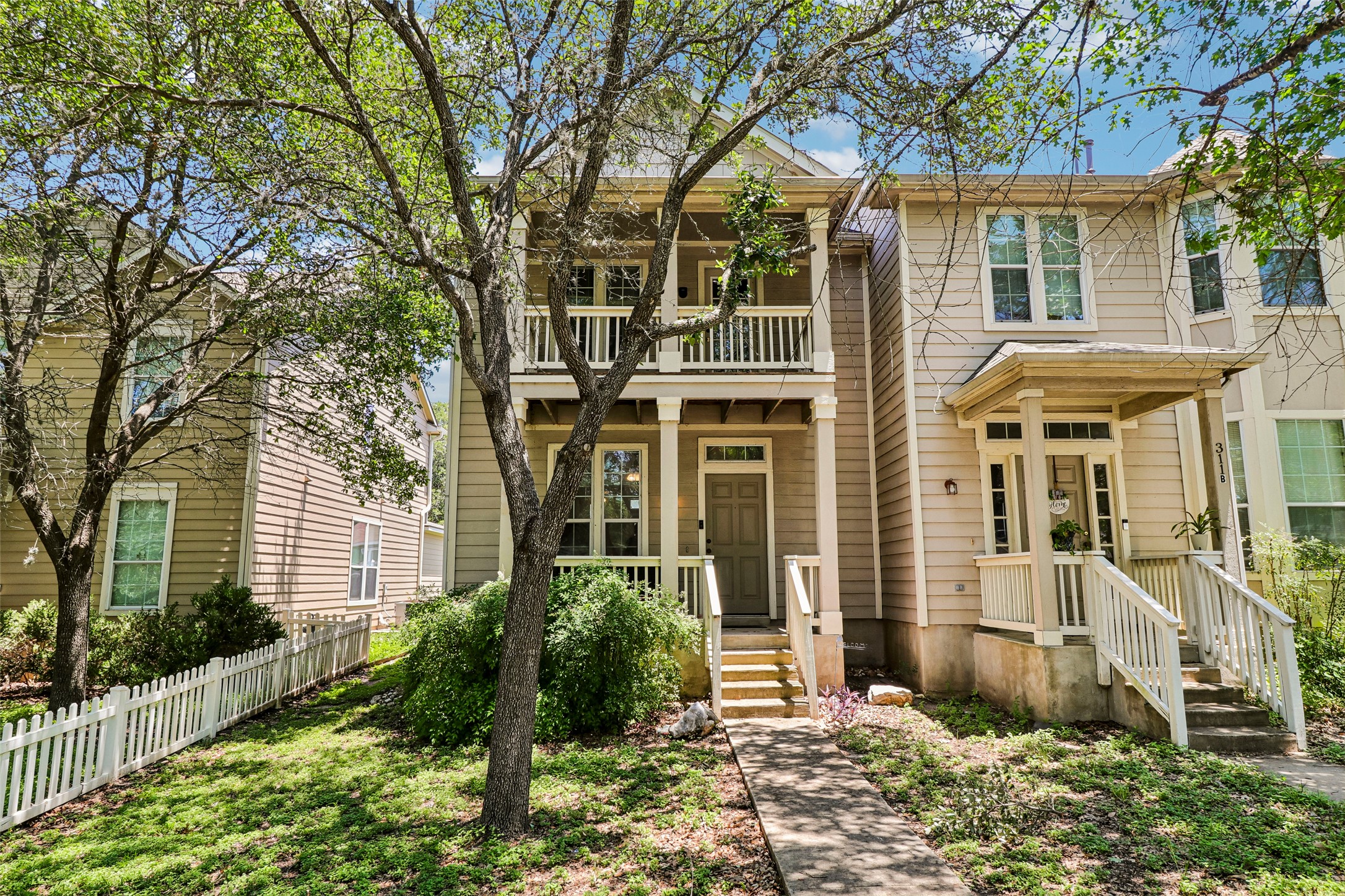 311 A Utterback Kyle, TX 78640 - Photo 1 of 40 front view of a house with a yard