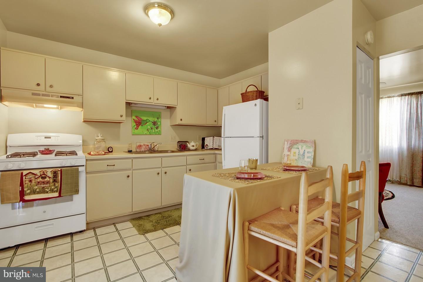 Kitchen from Dining Area/Living Room in backround