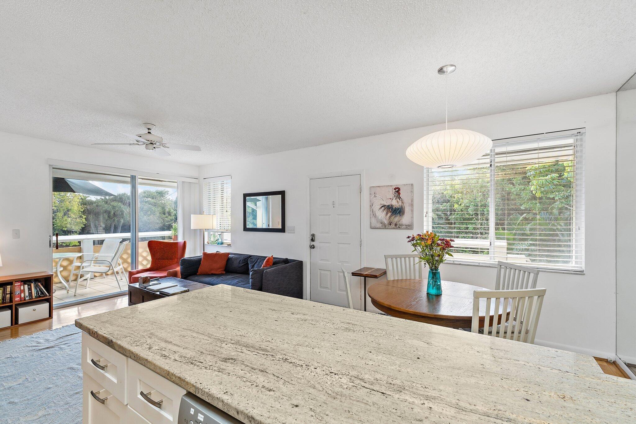 353 Highway 1, Unit C7 Jupiter, FL 33477 - Photo 13 of 45 a bedroom with furniture and a large window