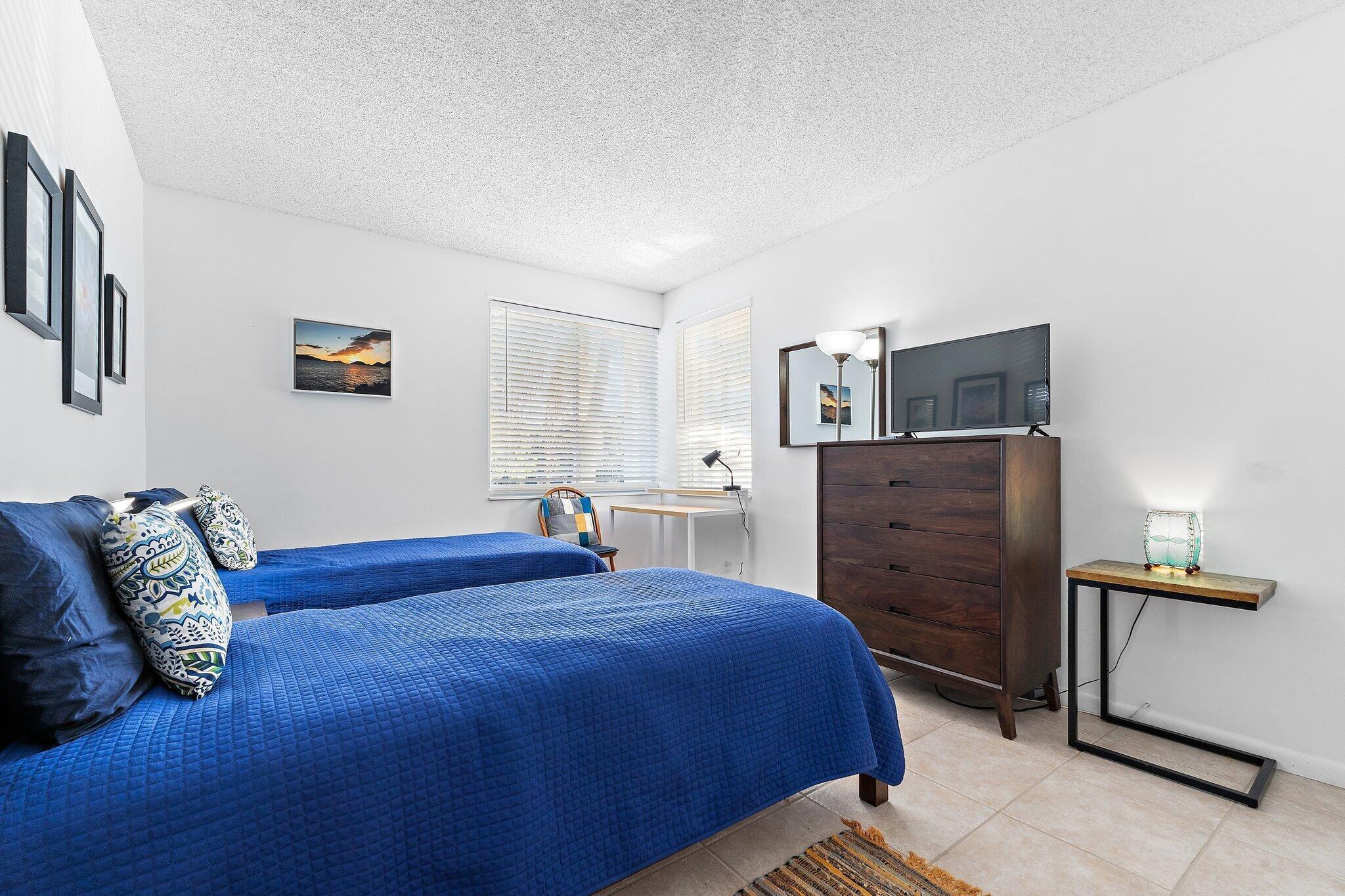 353 Highway 1, Unit C7 Jupiter, FL 33477 - Photo 15 of 45 a bedroom with a bed and furniture