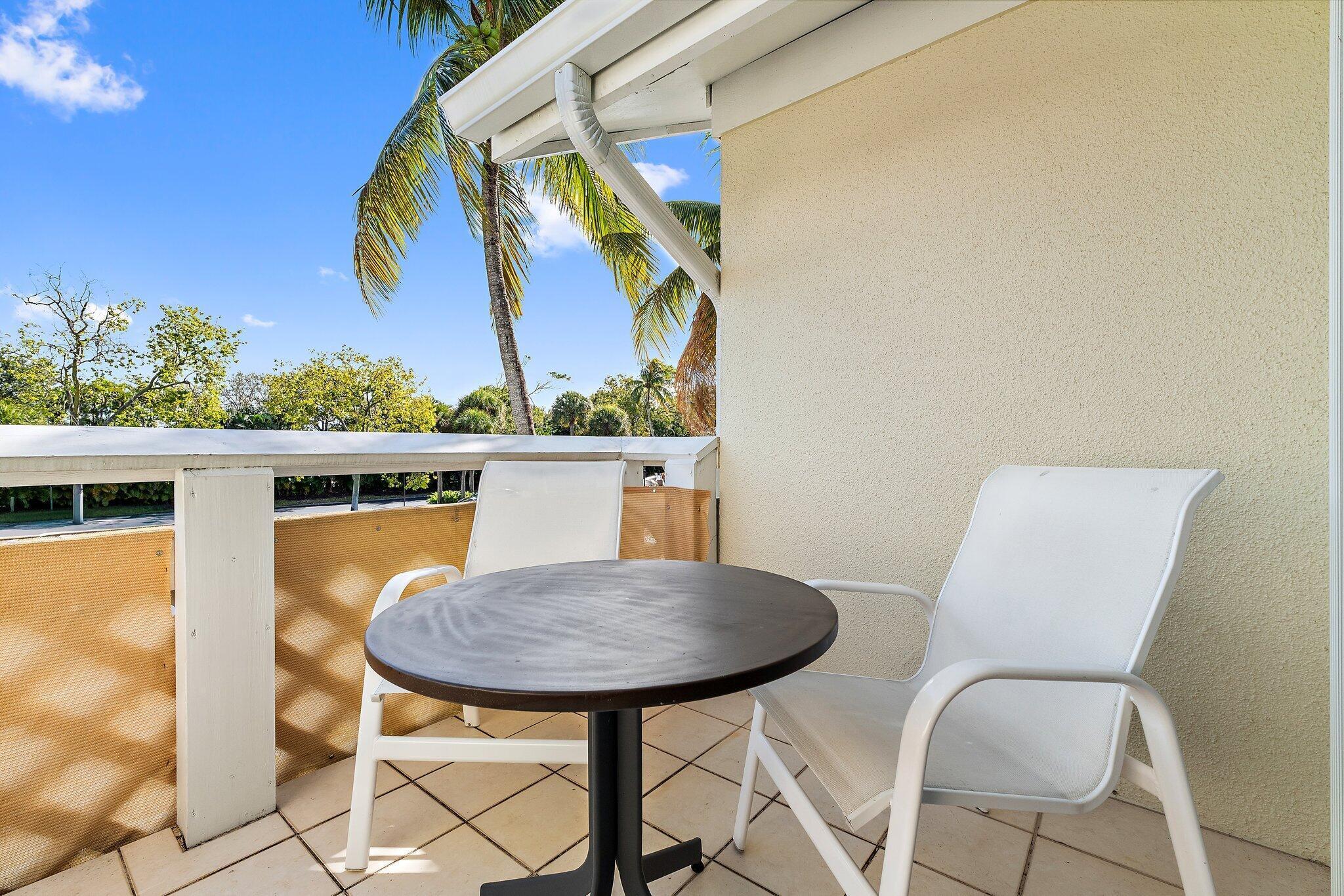 353 Highway 1, Unit C7 Jupiter, FL 33477 - Photo 33 of 45 a view of a dining room with furniture and wooden floor