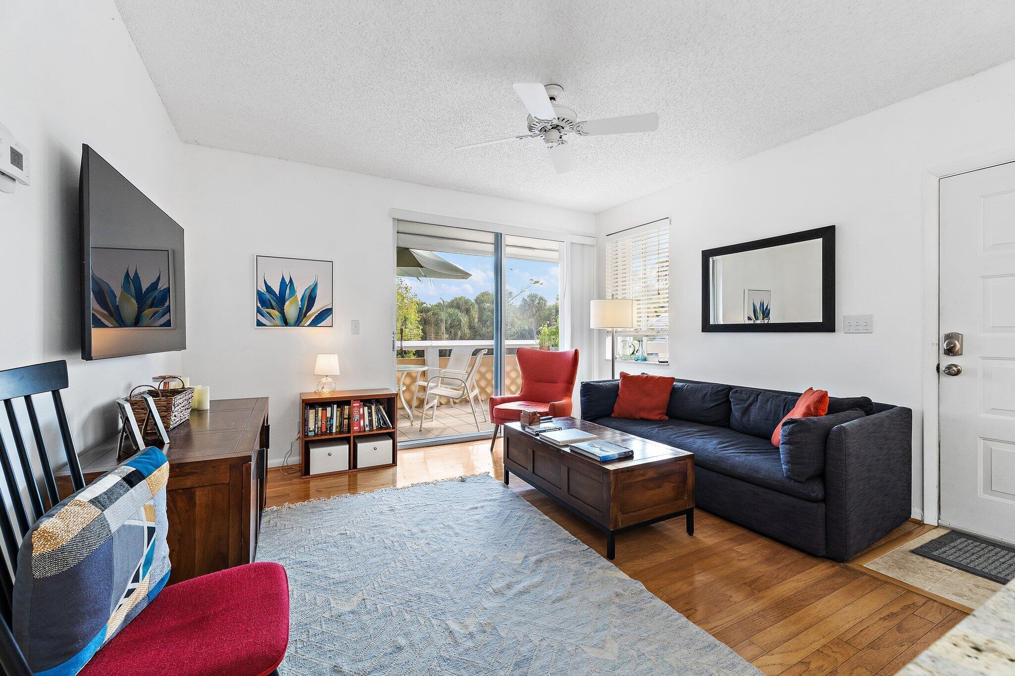 353 Highway 1, Unit C7 Jupiter, FL 33477 - Photo 5 of 45 a living room with furniture and a couch