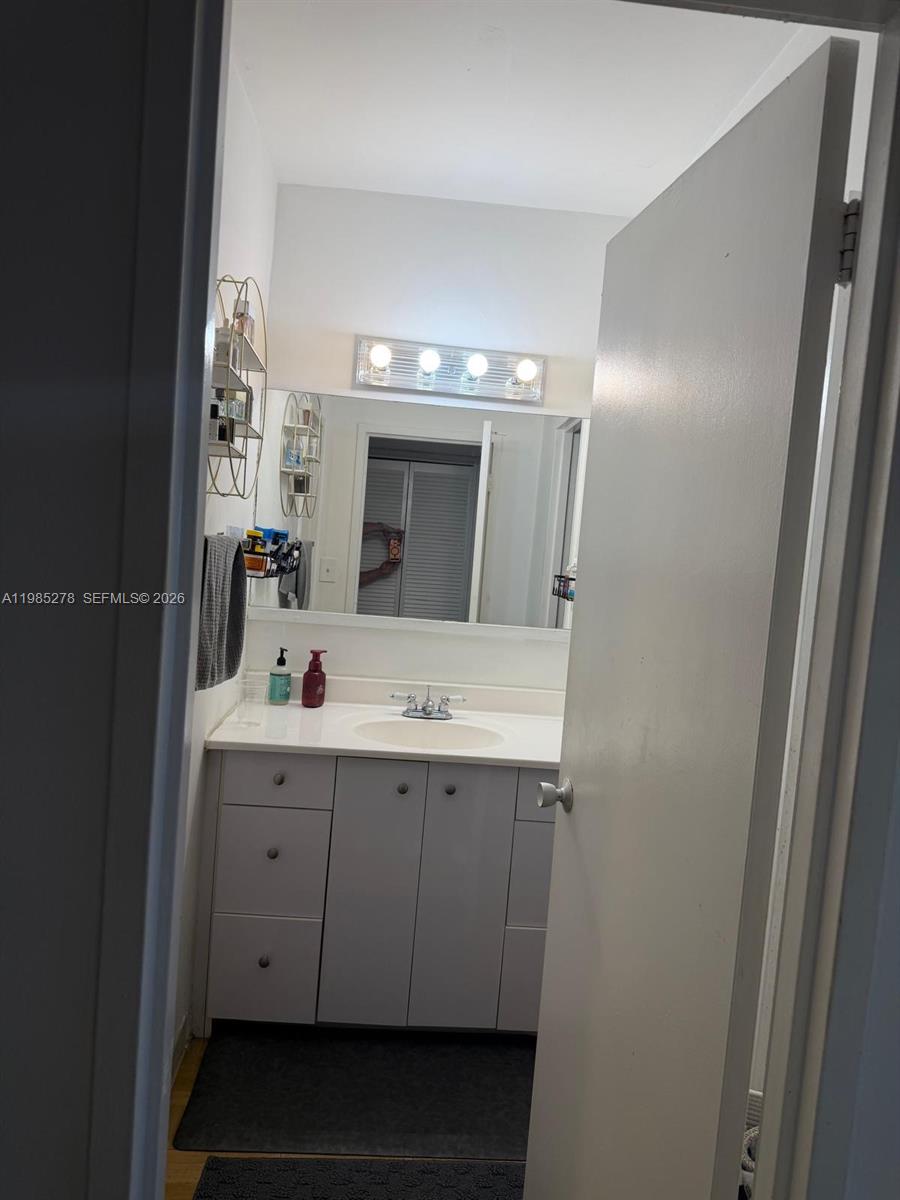 100 Lincoln Road, Unit 1512 Miami Beach, FL 33139 - Photo 6 of 21 a bathroom with a double vanity sink and mirror