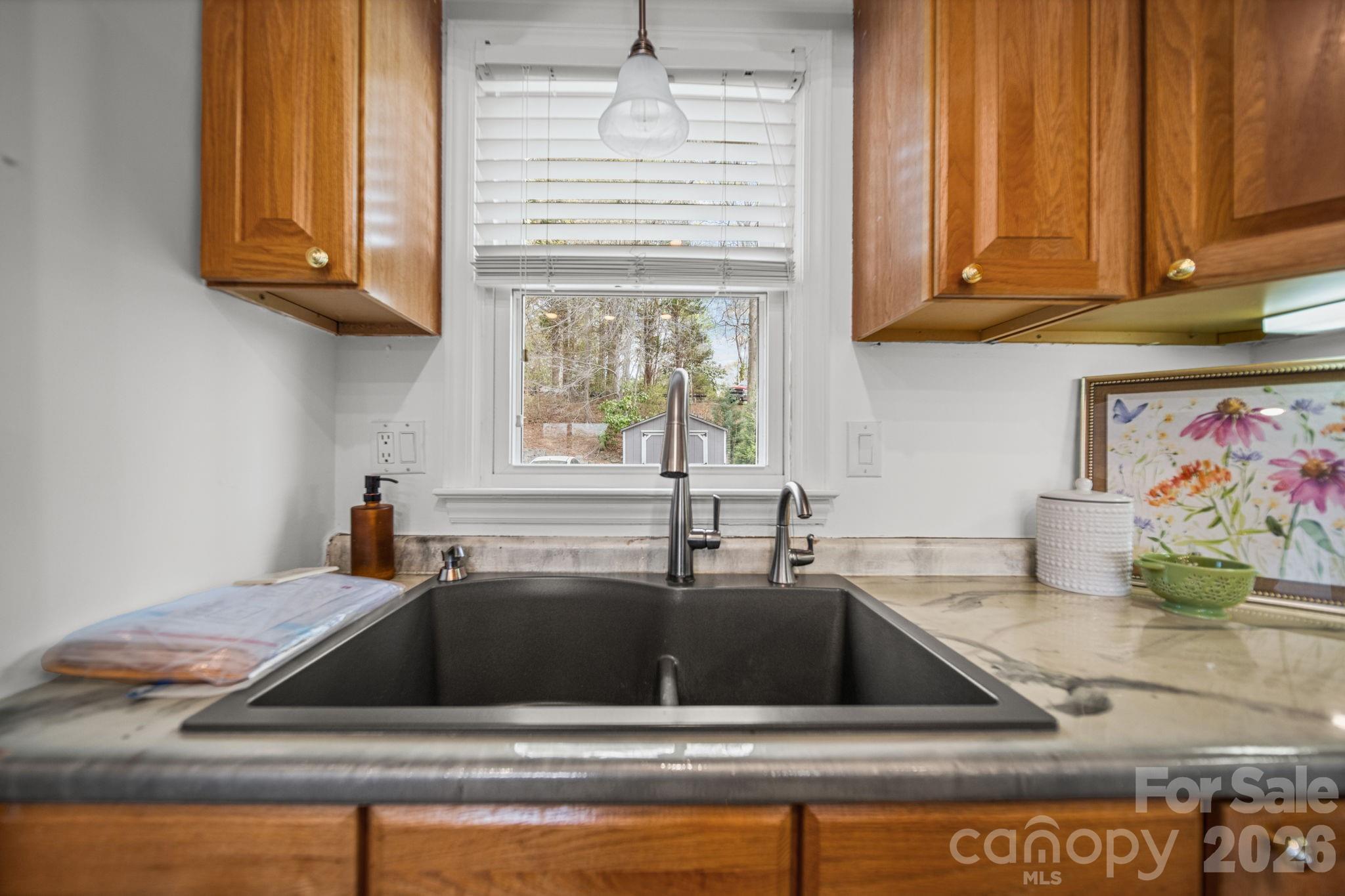 529 Catspaw Road Statesville, NC 28677 - Photo 14 of 48 a kitchen with a sink cabinets and a window