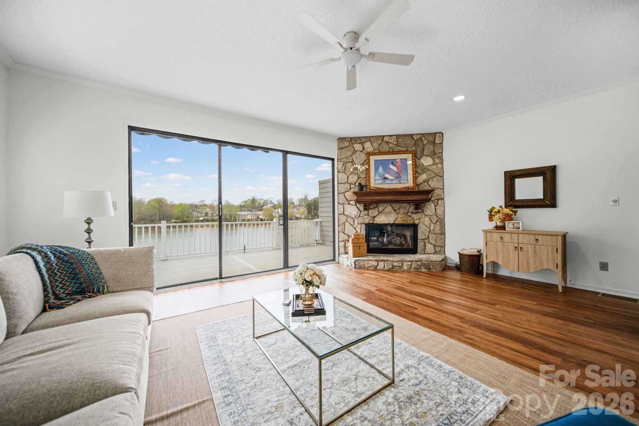 529 Catspaw Road Statesville, NC 28677 - Photo 15 of 48 a living room with furniture large window and fireplace