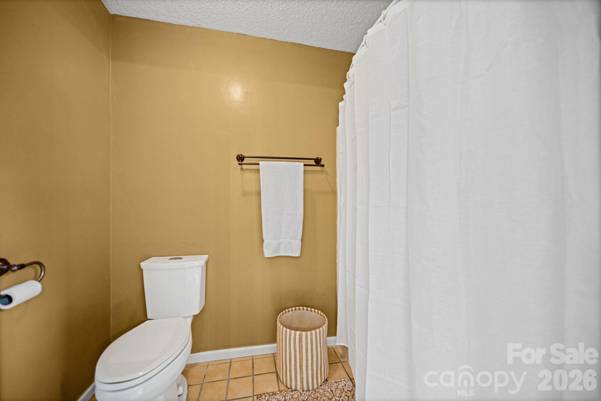 529 Catspaw Road Statesville, NC 28677 - Photo 18 of 48 a white toilet sitting next to a bathroom sink