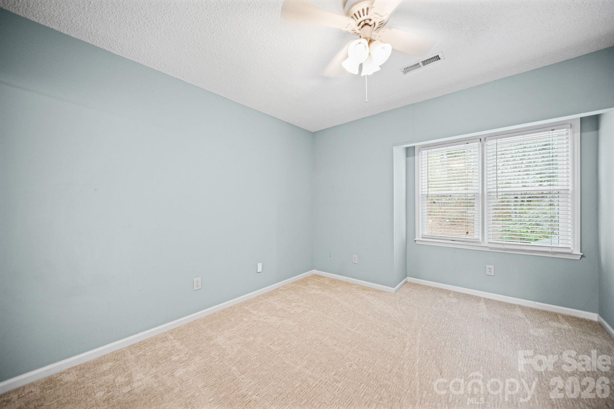 529 Catspaw Road Statesville, NC 28677 - Photo 21 of 48 a view of an empty room with a window