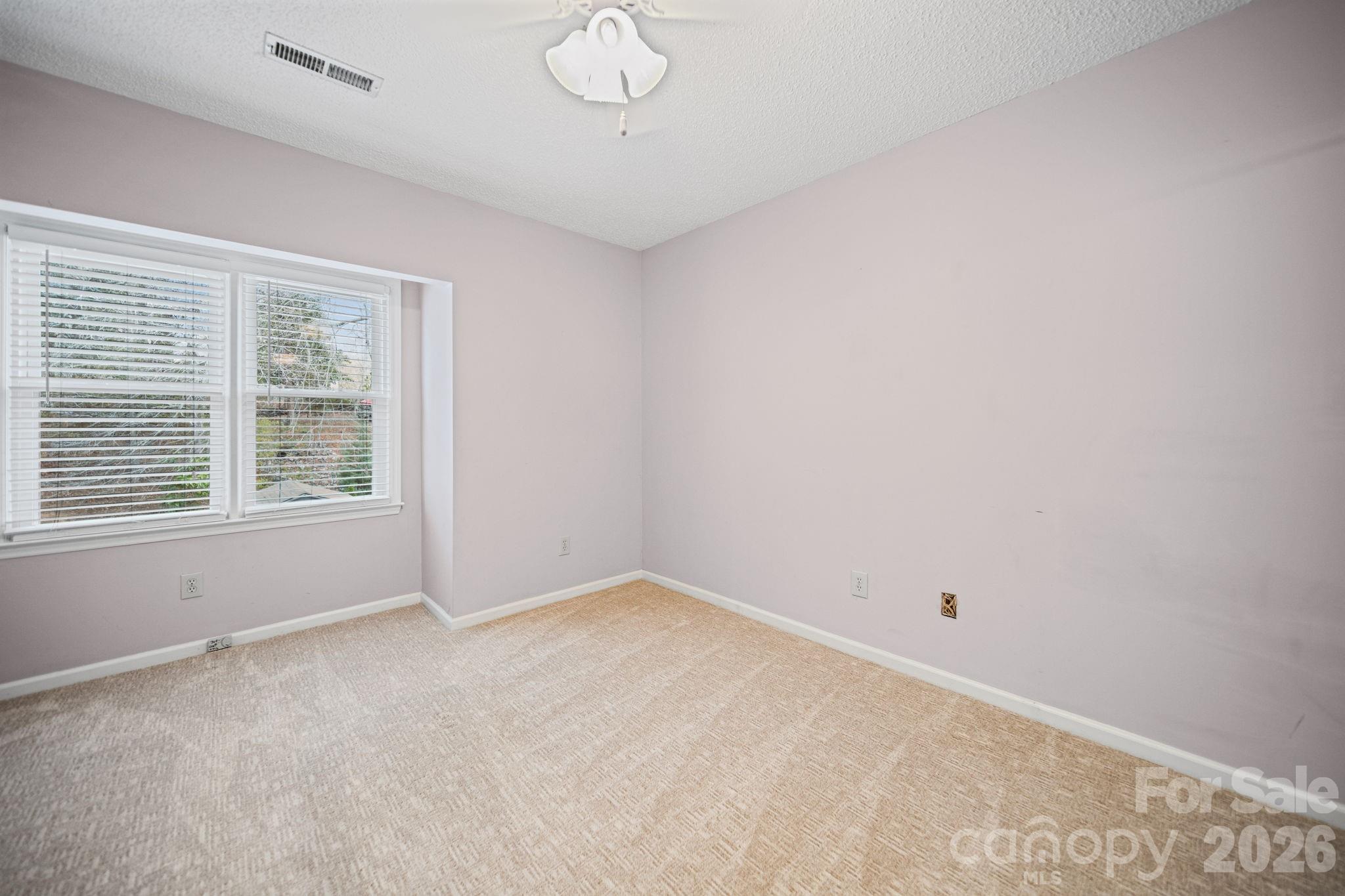 529 Catspaw Road Statesville, NC 28677 - Photo 23 of 48 an empty room with windows