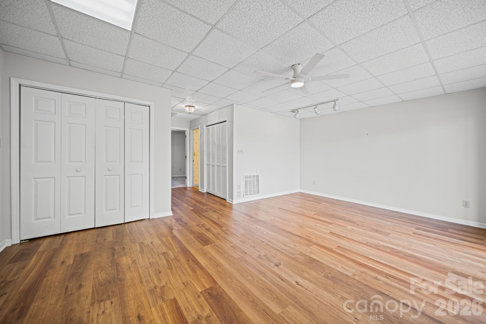 529 Catspaw Road Statesville, NC 28677 - Photo 24 of 48 a view of empty room with wooden floor and fan