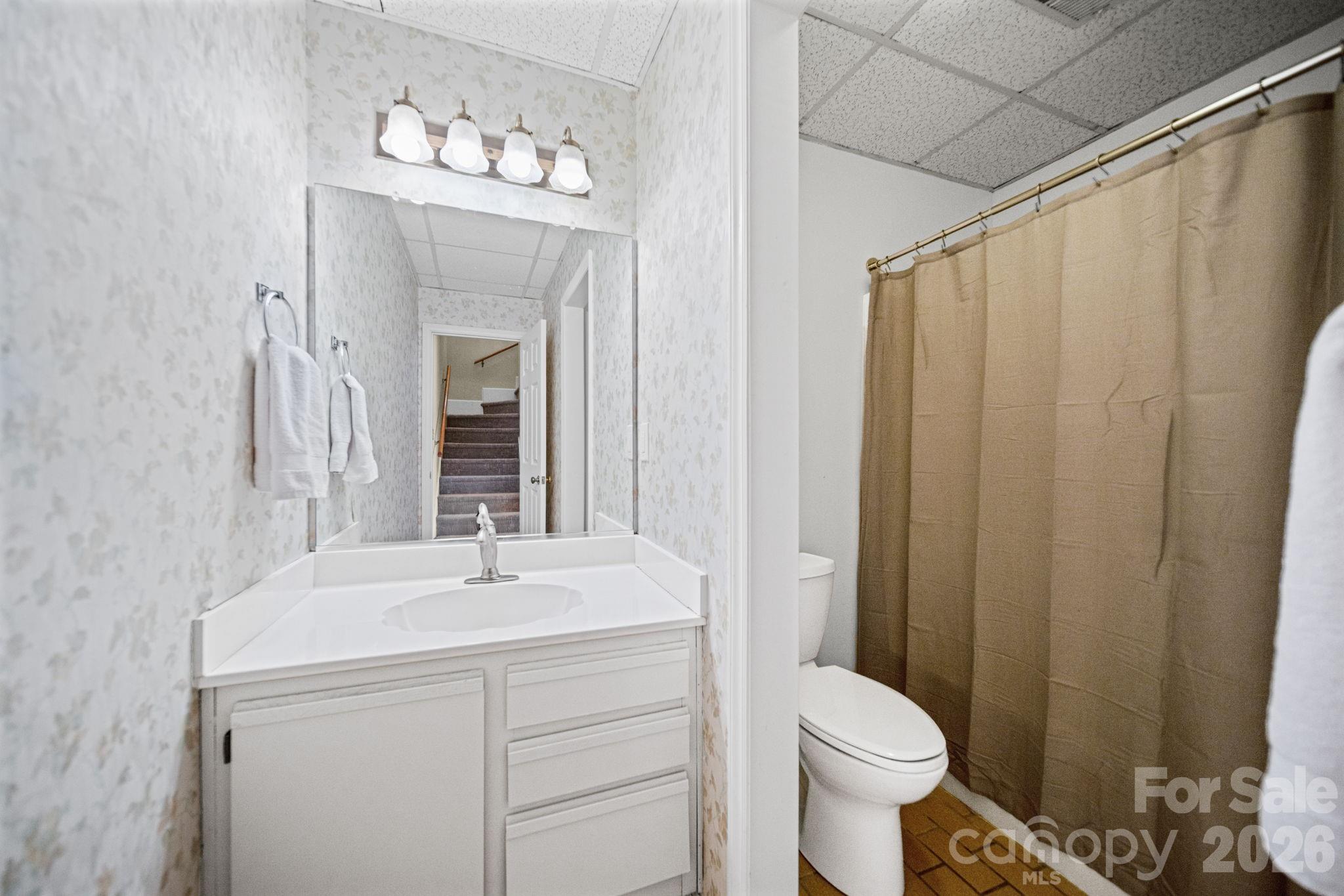 529 Catspaw Road Statesville, NC 28677 - Photo 26 of 48 a bathroom with a sink vanity mirror and toilet