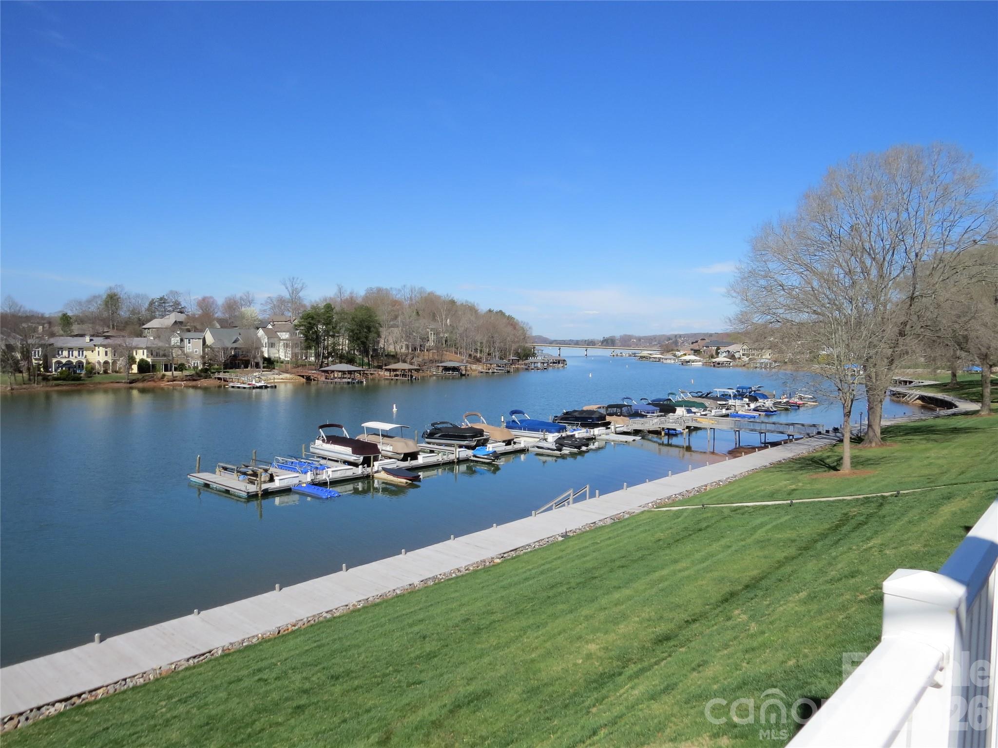 529 Catspaw Road Statesville, NC 28677 - Photo 32 of 48 a view of a lake with lawn chairs