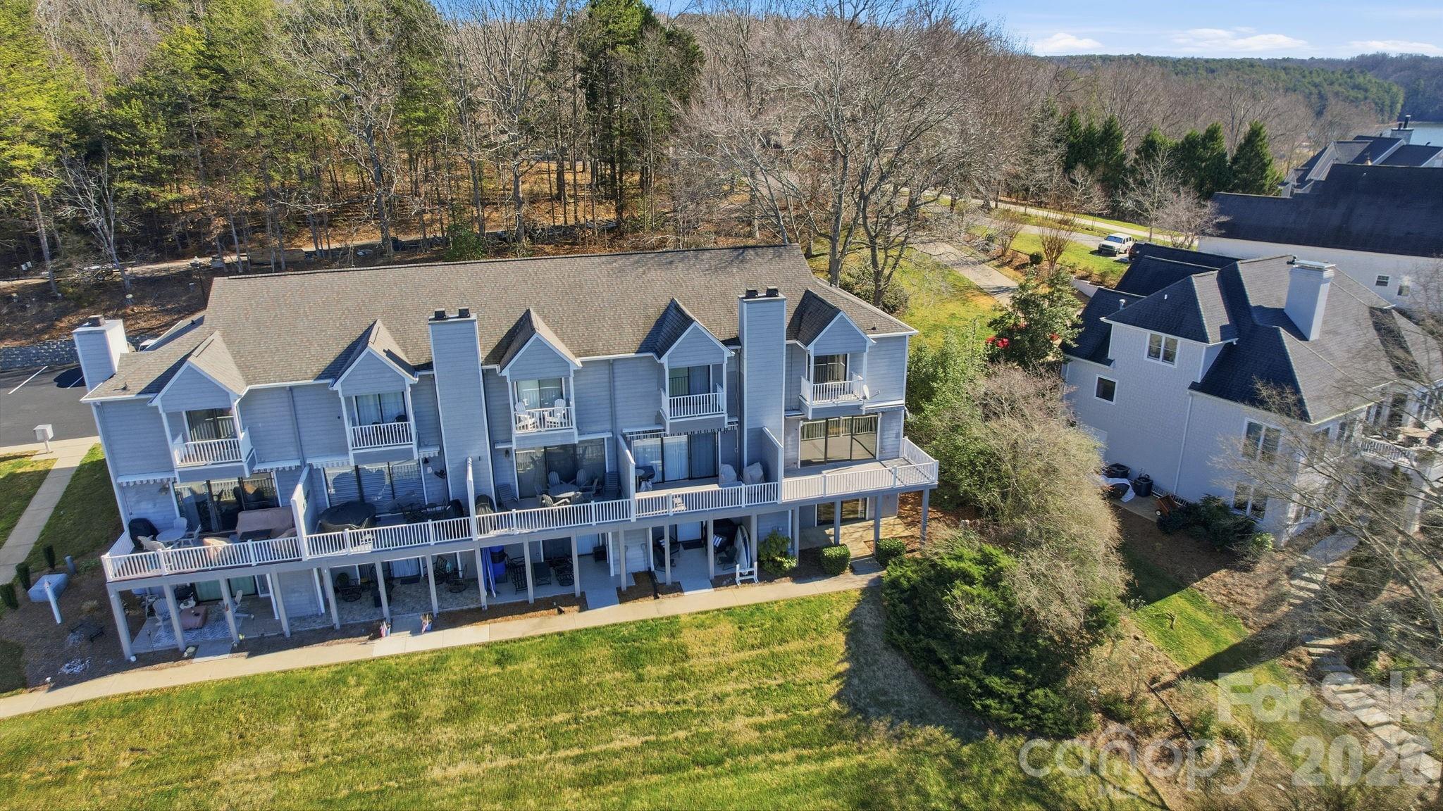 529 Catspaw Road Statesville, NC 28677 - Photo 43 of 48 a aerial view of a house with swimming pool and large trees