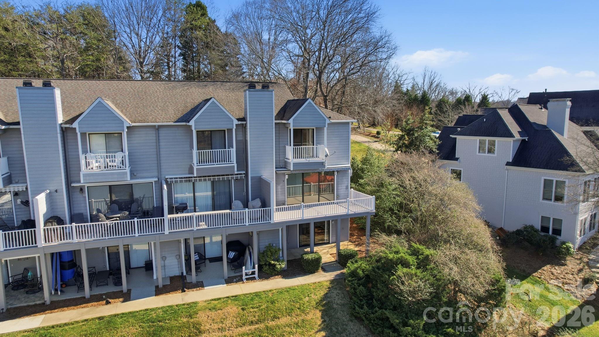 529 Catspaw Road Statesville, NC 28677 - Photo 45 of 48 a aerial view of a house with a yard and large trees