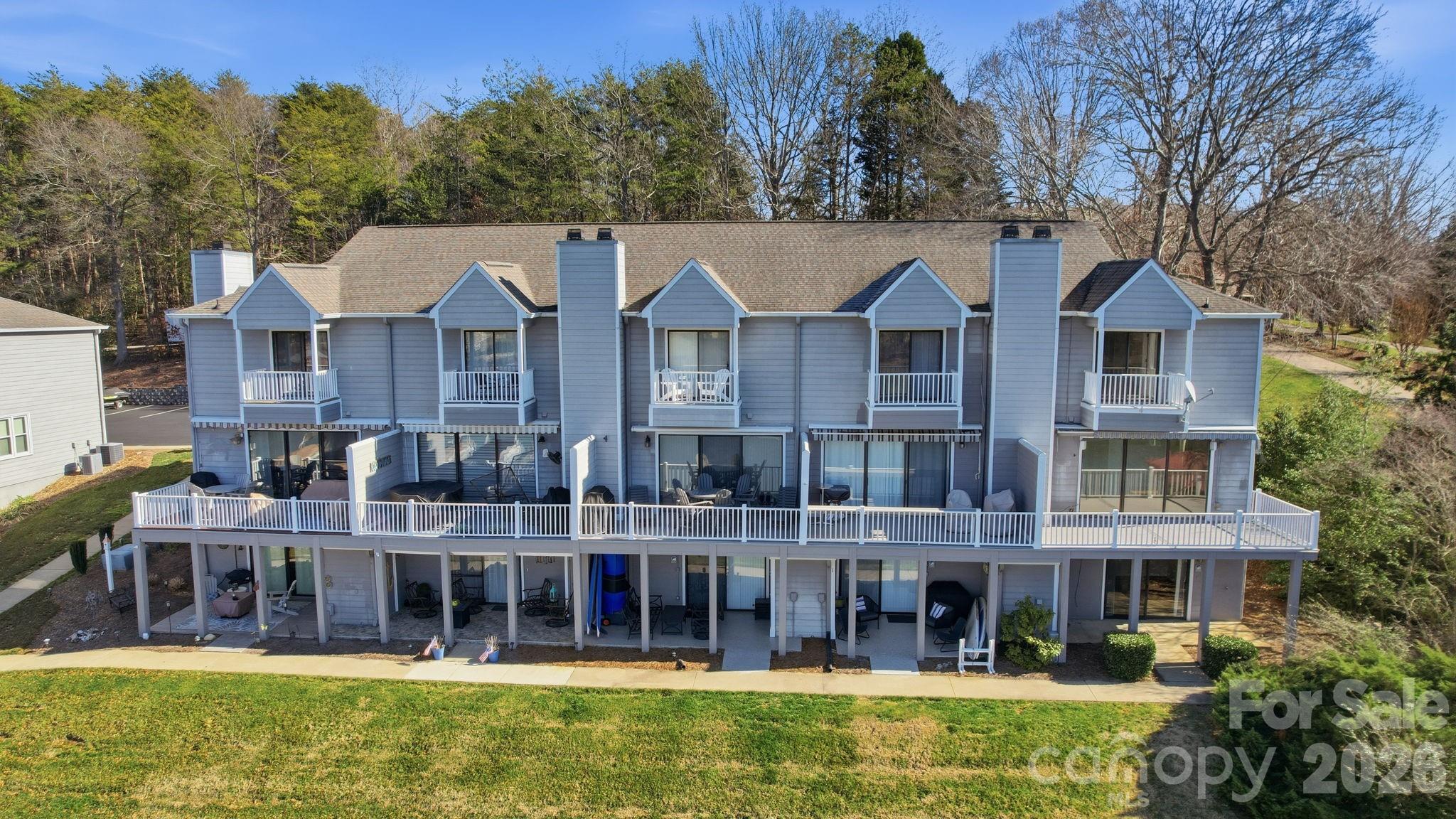 529 Catspaw Road Statesville, NC 28677 - Photo 47 of 48 a view of a large building with a large pool and large trees