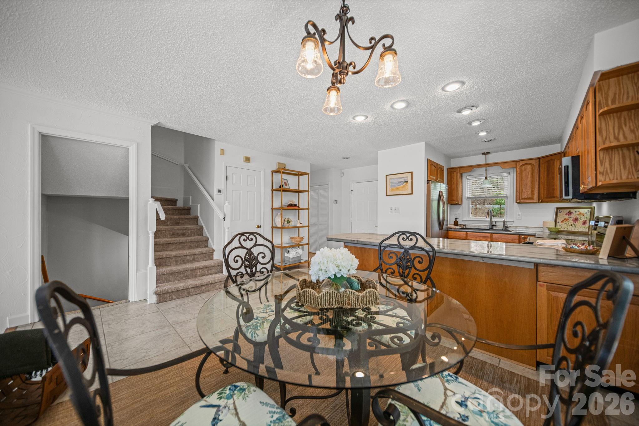 529 Catspaw Road Statesville, NC 28677 - Photo 5 of 48 a view of a dining room with furniture and a chandelier