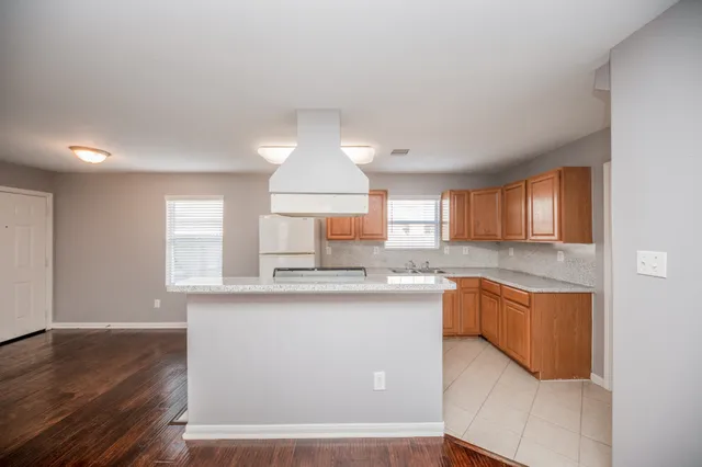 a kitchen with stainless steel appliances granite countertop a sink and cabinets