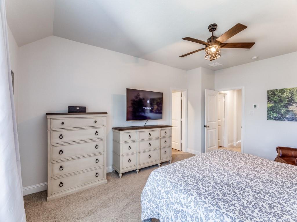 5944 Bursey Road Watauga, TX 76148 - Photo 19 of 25 a bedroom with a bed and a dresser