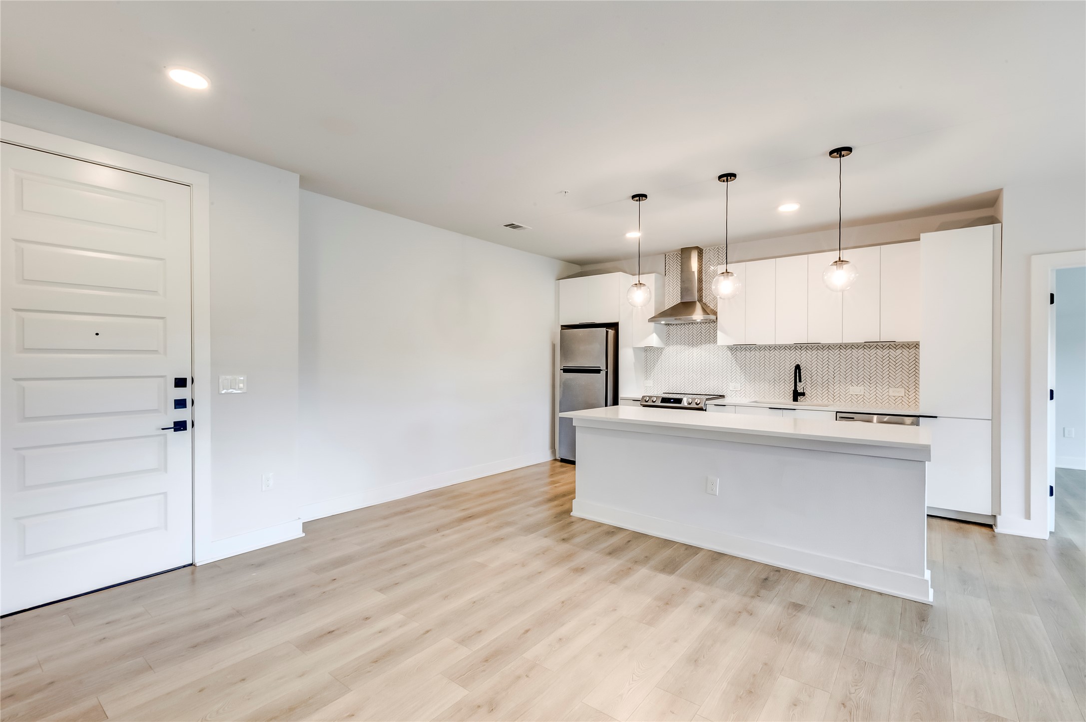 2500 Longview Street, Unit 402 Austin, TX 78705 - Photo 12 of 27 a view of kitchen with wooden floor and window