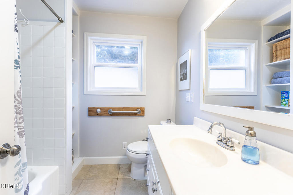 32751 Navarro Ridge Road Albion, CA 95410 - Photo 47 of 57 a bathroom with a sink a toilet and shower curtain