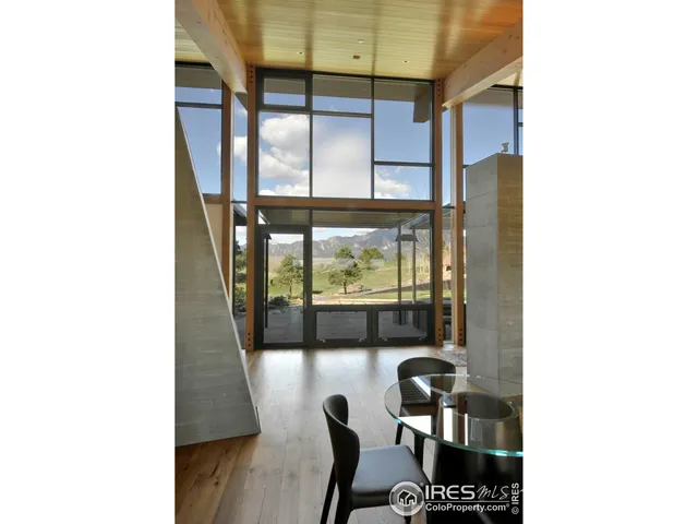 a picture of a room with a dining table and chairs